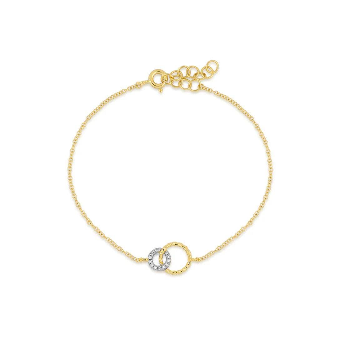 dainty yellow gold chain bracelet with interlocking circles, one accented with diamonds