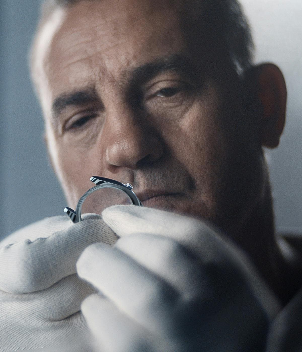 photo of a person inspecting a Rolex watch case